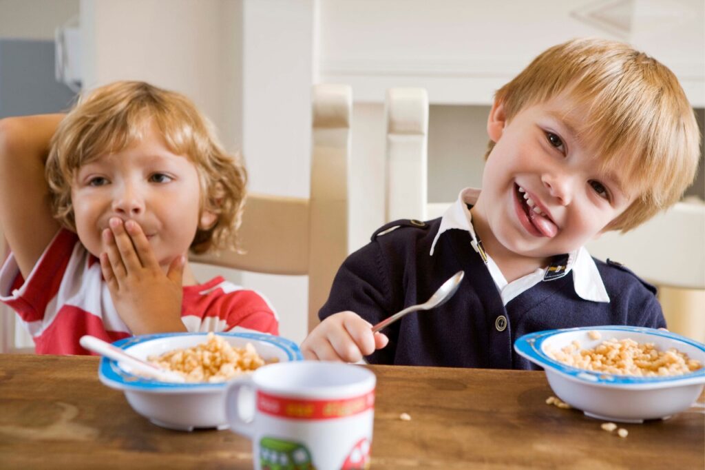 Kids eating cereals